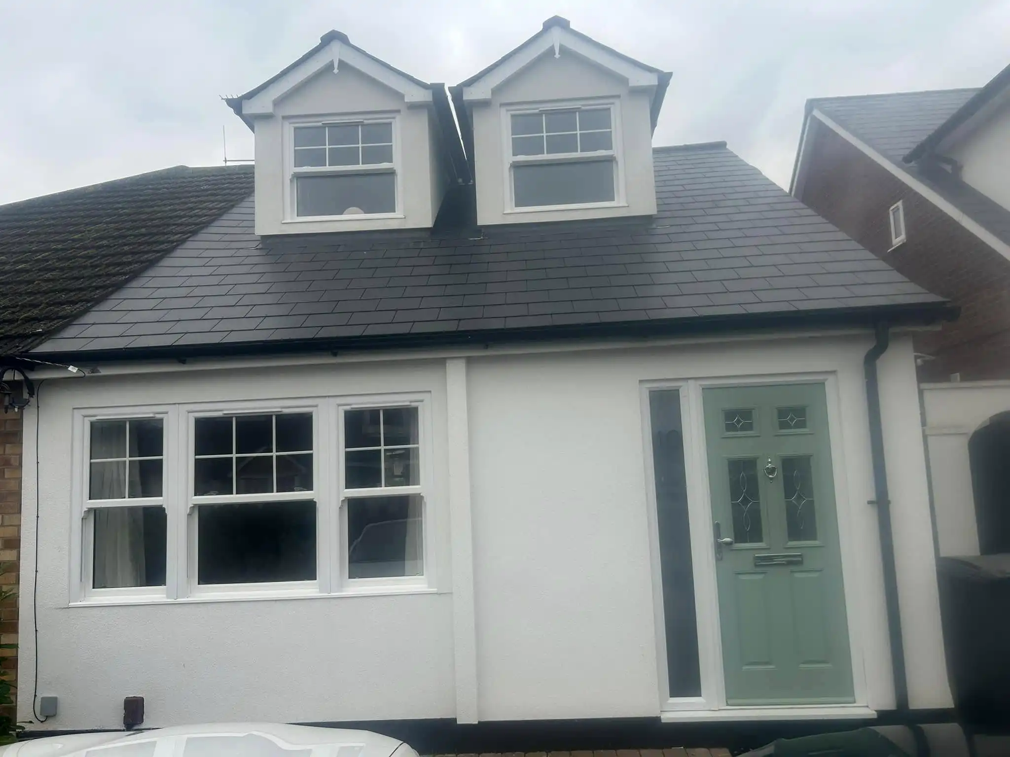 white house with green door
